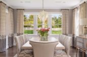 dining room with dining table and chairs and flower vase on top of the table